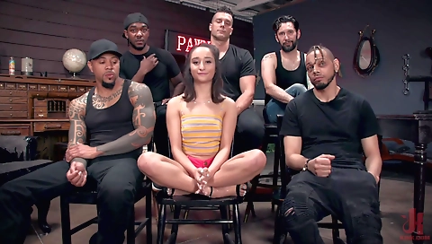 Amateur brunette in red dress gives a blowjob to her man