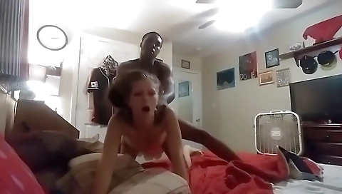 Amateur interracial video with a small-titted brunette