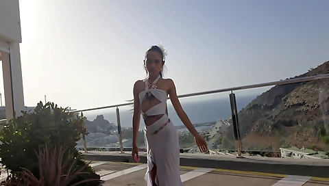 Asian girl fucked by a black guy in a public balcony