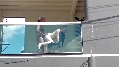 Blonde in a black trench coat fucked by a black guy