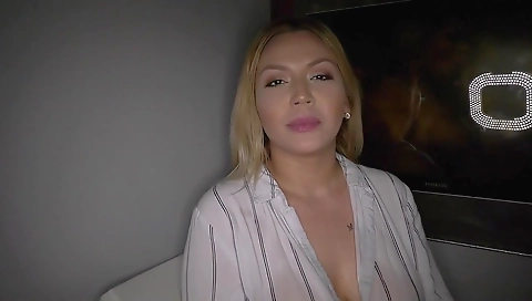 Blonde with big tits and a big ass in a black dress