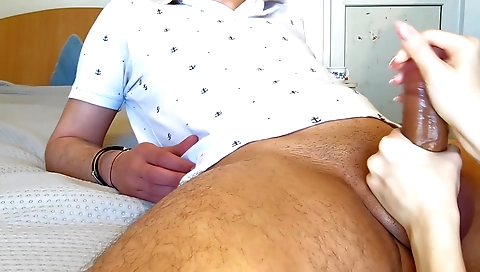 Interracial handjob with a horny guy and a slutty girl